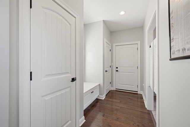 mudroom with baseboards, dark wood-style flooring, and recessed lighting