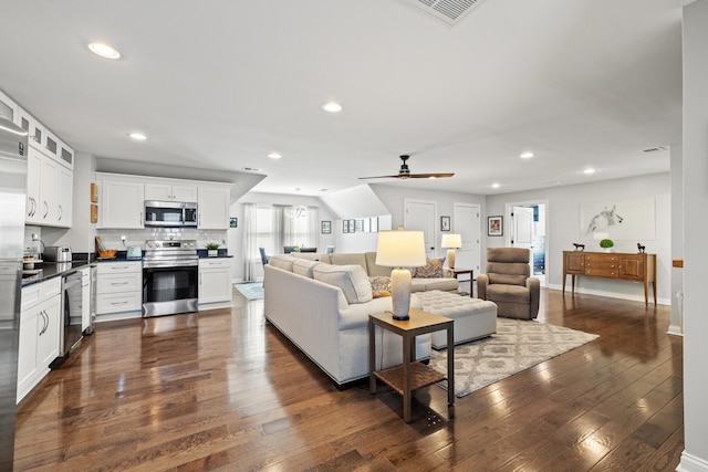 living room featuring recessed lighting, visible vents, dark wood finished floors, and ceiling fan