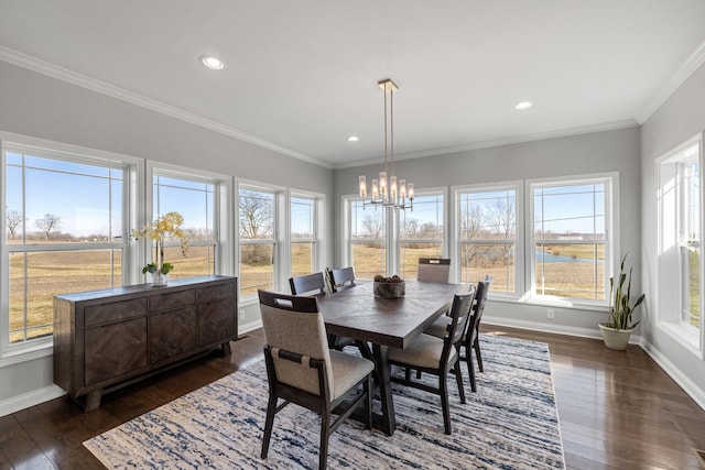 dining room with baseboards, ornamental molding, dark wood-style flooring, an inviting chandelier, and recessed lighting