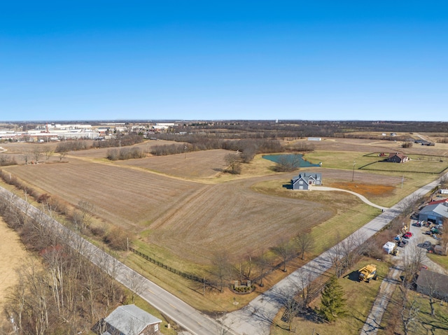 birds eye view of property with a rural view