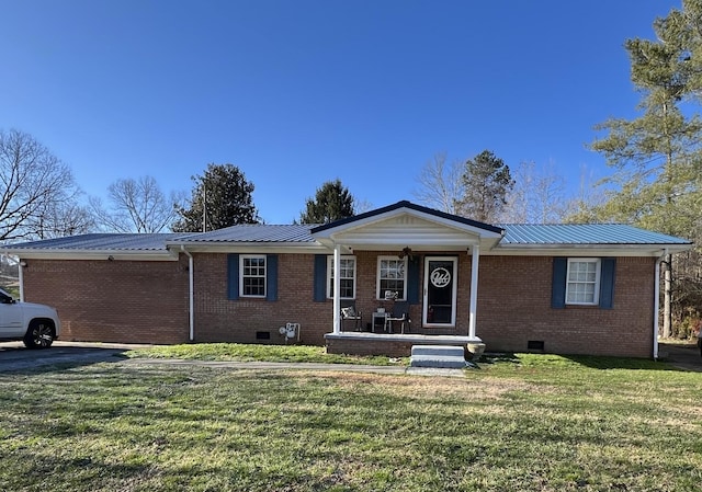 view of front of home with crawl space, brick siding, a front lawn, and covered porch