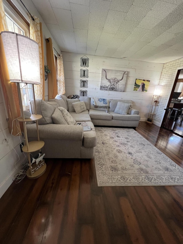 unfurnished living room featuring dark wood finished floors