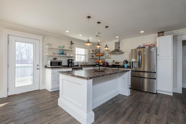 kitchen featuring open shelves, dark countertops, appliances with stainless steel finishes, white cabinets, and wall chimney range hood