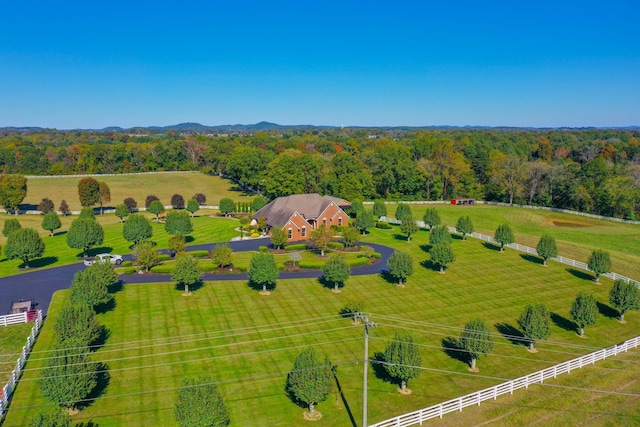 aerial view featuring a rural view and a view of trees