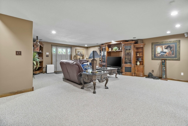 living room with baseboards, light colored carpet, and recessed lighting