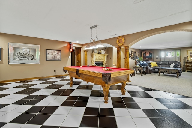 game room featuring arched walkways, recessed lighting, a fireplace, baseboards, and ornate columns