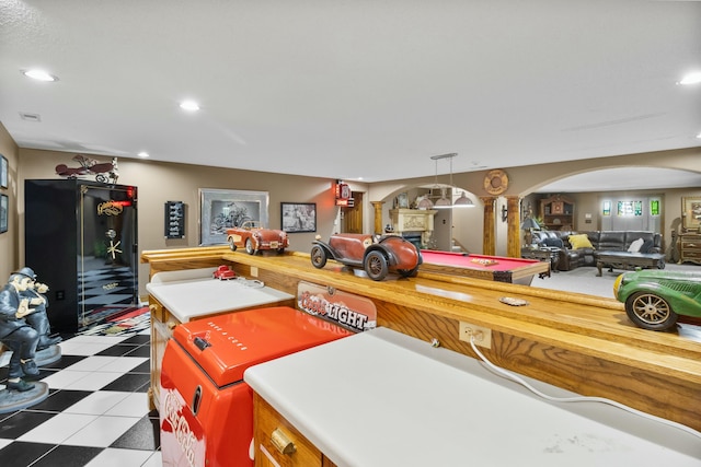 playroom featuring light floors, visible vents, arched walkways, and recessed lighting