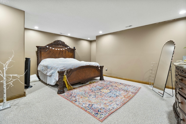 bedroom with light carpet, visible vents, baseboards, and recessed lighting