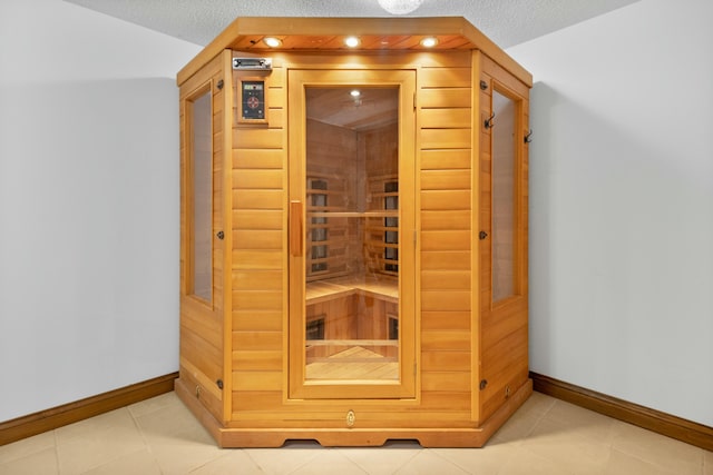 view of sauna with recessed lighting, baseboards, and tile patterned floors