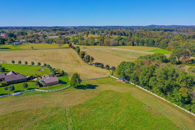 birds eye view of property with a rural view