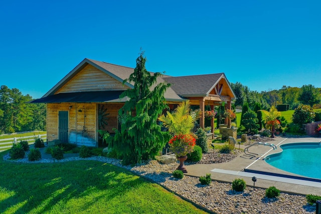 exterior space with a patio area and a lawn