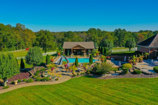 exterior space featuring a patio area, a gazebo, fence, and a yard