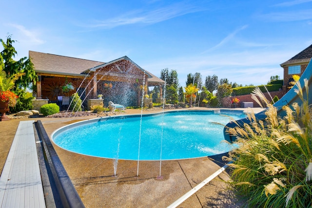 pool featuring a patio area