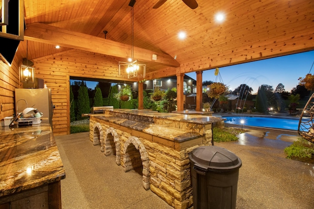 exterior space featuring vaulted ceiling, wood ceiling, decorative light fixtures, and wooden walls