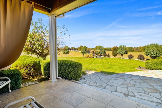 view of patio / terrace with a rural view