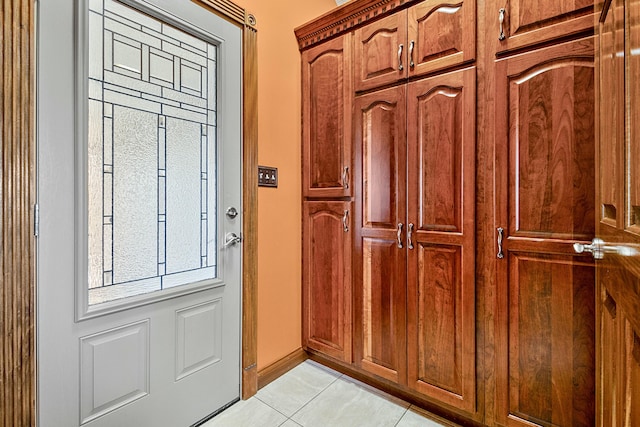 interior space featuring light tile patterned floors and baseboards