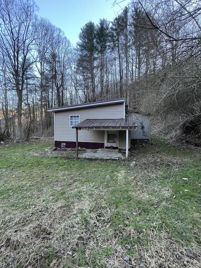 exterior space featuring metal roof