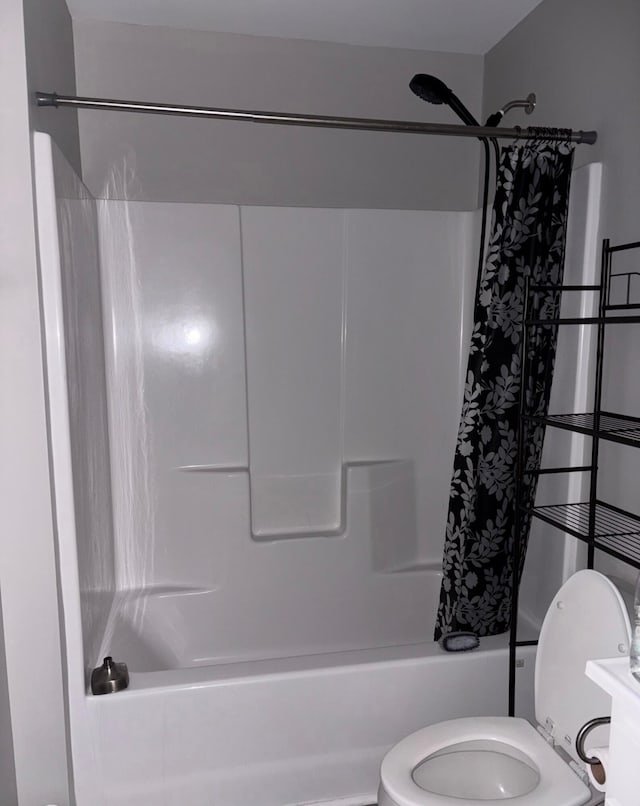 full bath with toilet and shower / tub combo