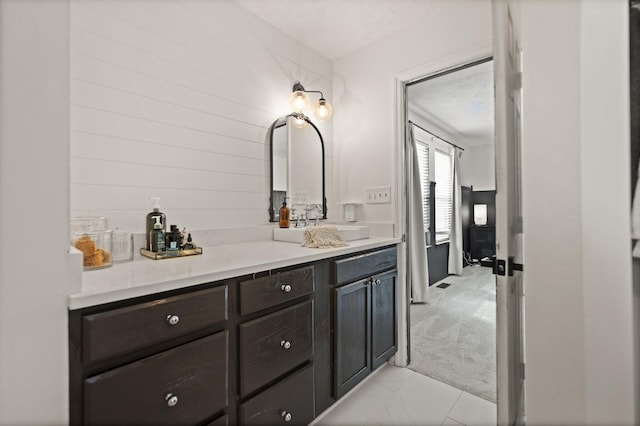 bathroom with vanity and a textured ceiling