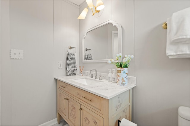 bathroom featuring toilet and vanity