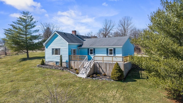 view of front of home featuring a chimney, roof with shingles, stairs, a deck, and a front lawn