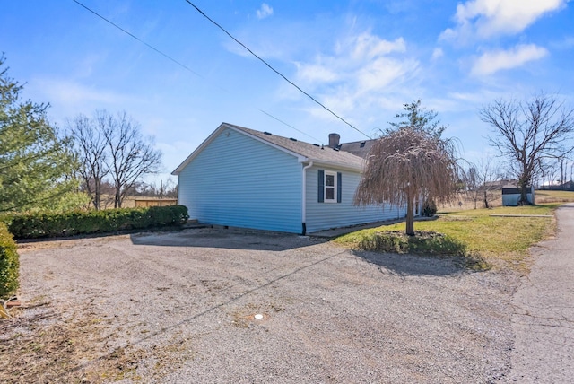 view of property exterior featuring driveway