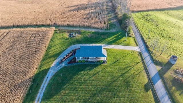 birds eye view of property with a rural view