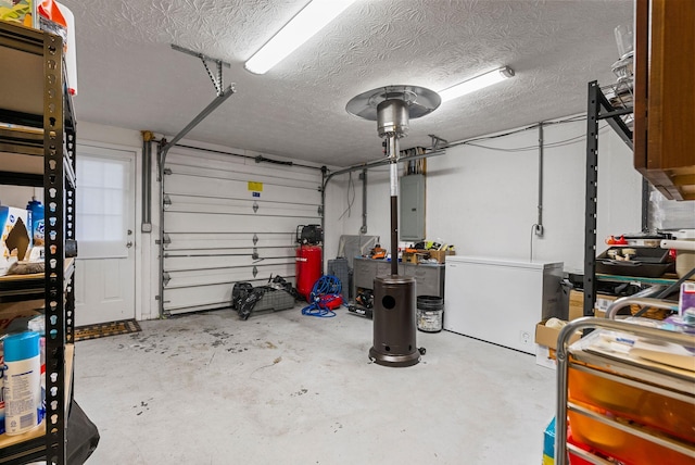 garage featuring fridge and electric panel