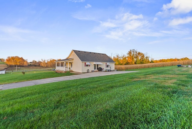 rear view of house with a yard