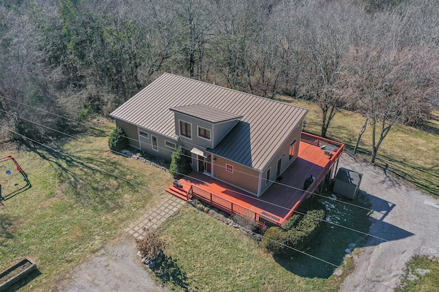 birds eye view of property with a view of trees