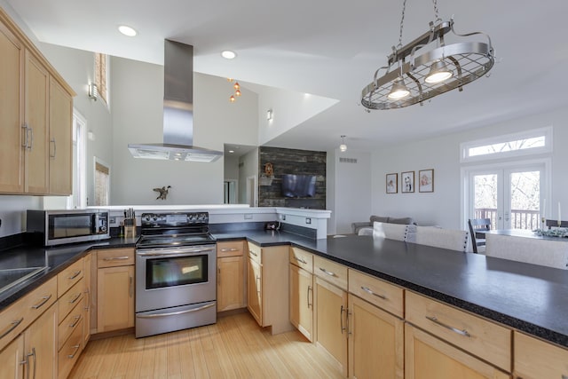 kitchen featuring island exhaust hood, open floor plan, stainless steel appliances, and light brown cabinetry