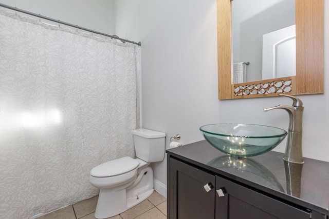 full bath featuring baseboards, vanity, toilet, and tile patterned floors