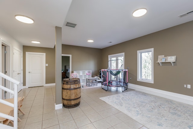 sitting room featuring visible vents, baseboards, and light tile patterned floors