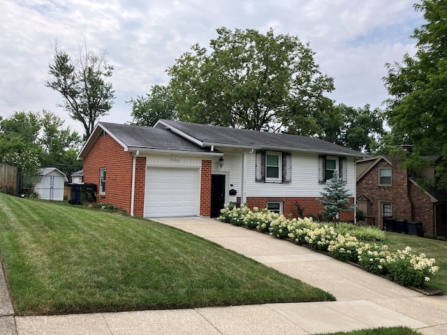 split foyer home with a front yard, brick siding, driveway, and an attached garage