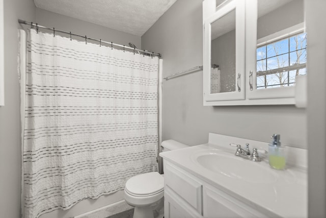 full bathroom featuring toilet, shower / bath combo, vanity, and a textured ceiling