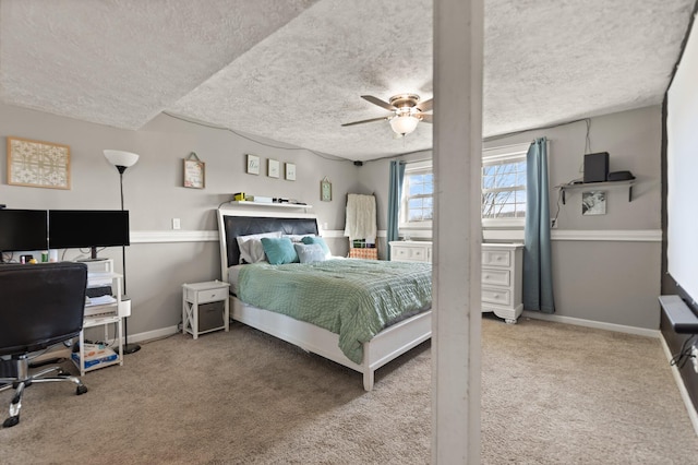 bedroom featuring carpet flooring, ceiling fan, a textured ceiling, and baseboards