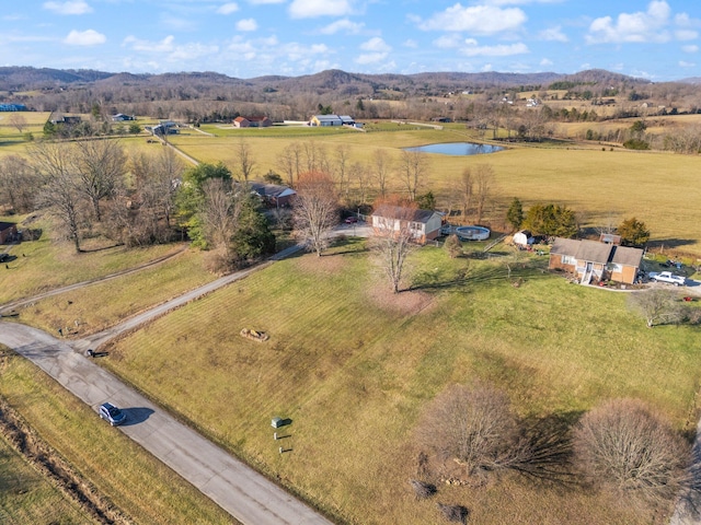 bird's eye view featuring a rural view and a water and mountain view