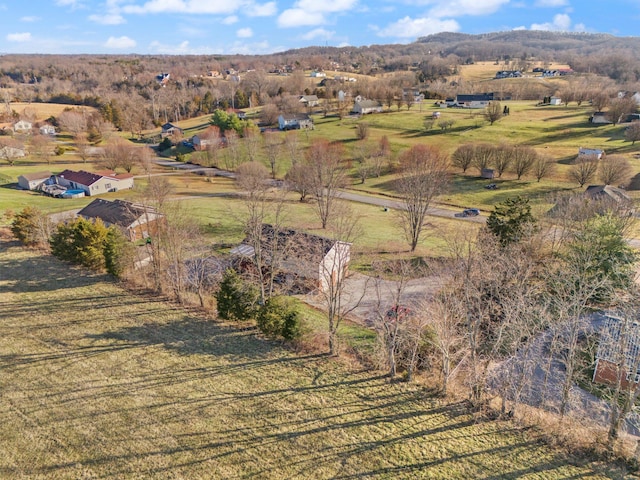 birds eye view of property with a rural view