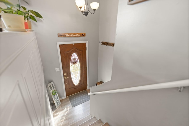 entryway featuring a chandelier and light wood-type flooring