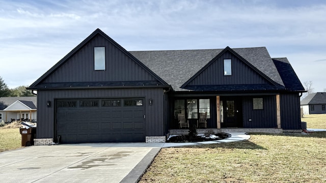 modern inspired farmhouse with a garage, a shingled roof, concrete driveway, covered porch, and a front lawn