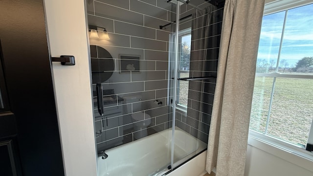 full bathroom with shower / bath combination with glass door