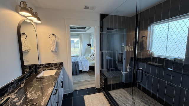 full bathroom with ensuite bathroom, tile patterned flooring, visible vents, vanity, and a shower stall