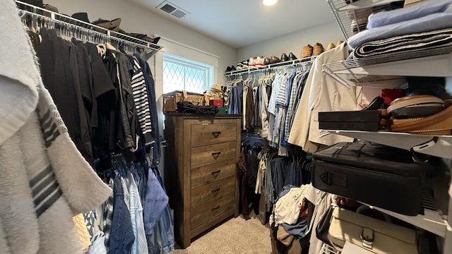 walk in closet with carpet floors and visible vents