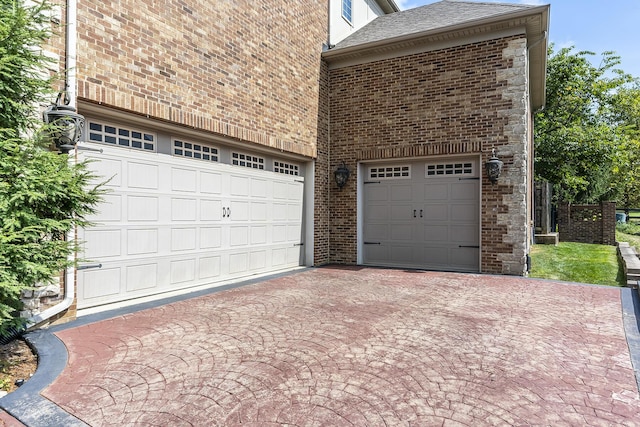 garage featuring driveway