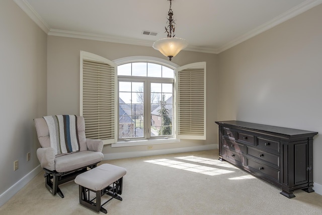 sitting room with light colored carpet, visible vents, crown molding, and baseboards