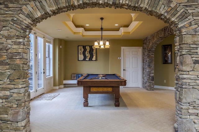 playroom featuring carpet floors, arched walkways, crown molding, a raised ceiling, and pool table