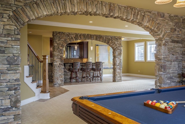 rec room with arched walkways, crown molding, a dry bar, and billiards