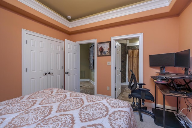 tiled bedroom with baseboards, ornamental molding, and a tray ceiling