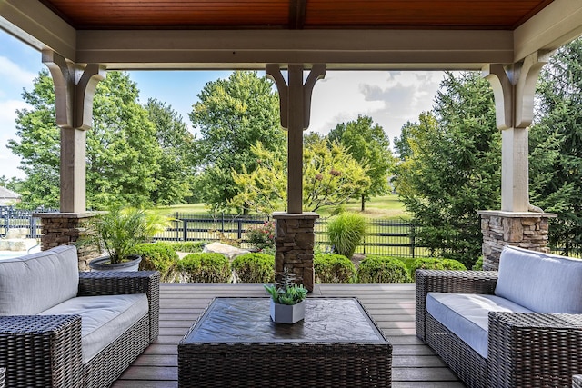 deck with fence and an outdoor hangout area