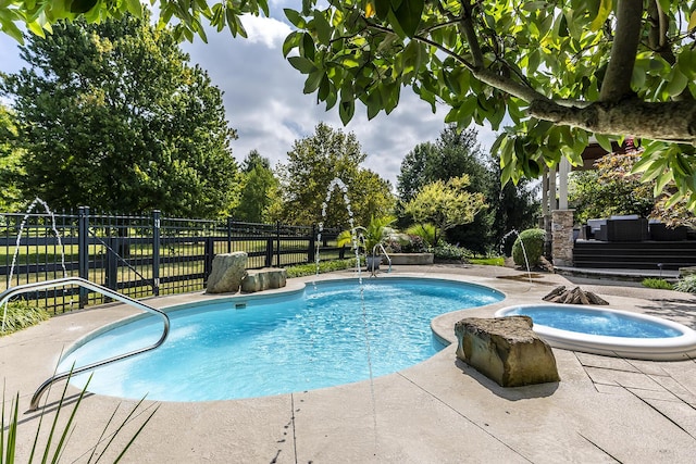 view of swimming pool featuring a patio, fence, and a fenced in pool